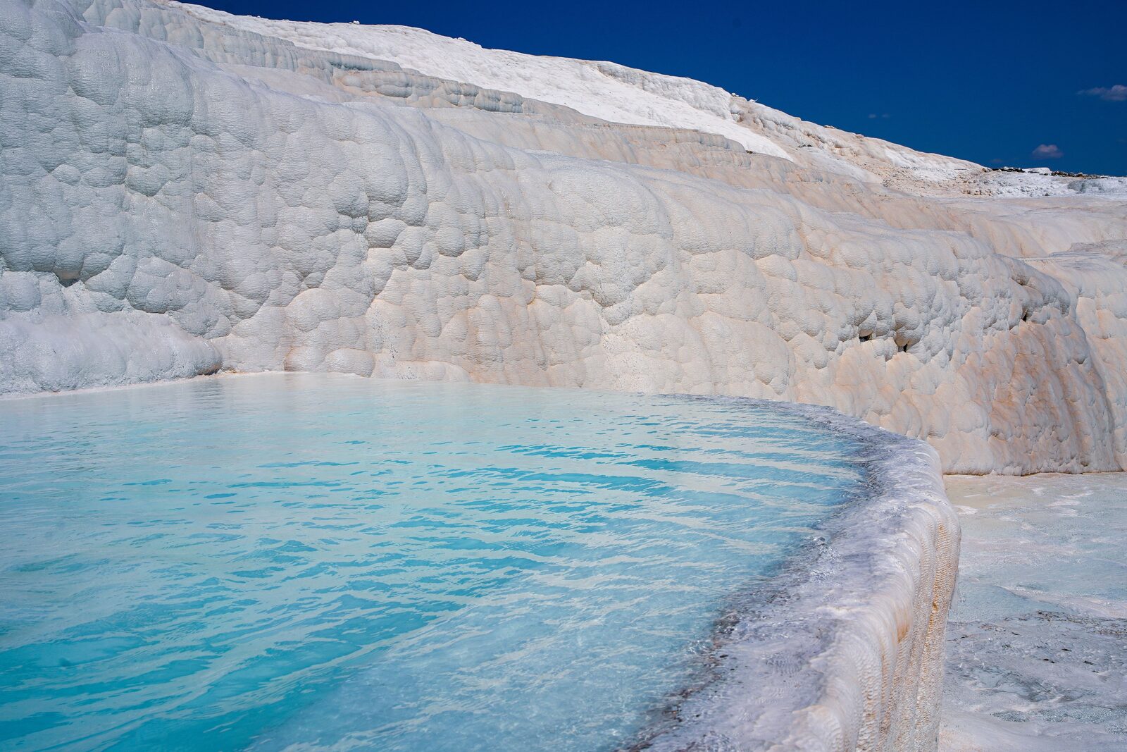 White travertine terraces and turquoise pools at Pamukkale